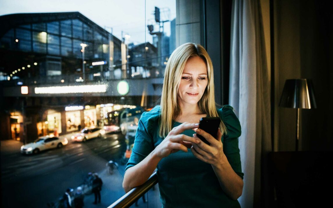 businesswoman networking using her smartphone businesswoman networking using her smartphone